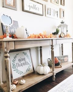 a bright fall or Thanksgiving console table with colorful fall leaves fabric or plastic pumpkins an 240x300 - How To Decorate Your Home & Hallway In Autumn & Fall Season